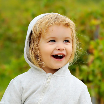 Pediatric Dentistry Roswell child laughing in dental care visit