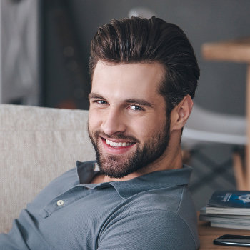 Smiling handsome businessman Dunwoody Dental Health patient