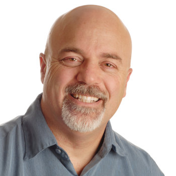 Middle aged man smiling Dunwoody Dental Health patient image